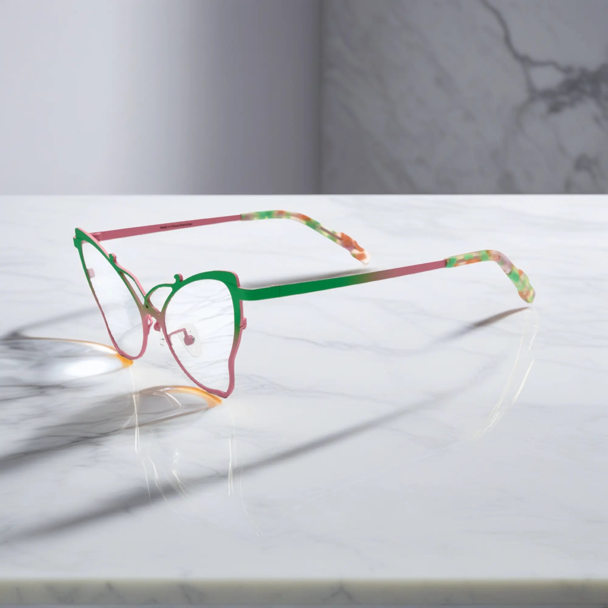 Side of VoyueLens™ VL185862 titanium butterfly eyeglasses in Green Blush – a lightweight, colorful, vintage-inspired, prescription ready frame designed for unique artistic style and everyday comfort.